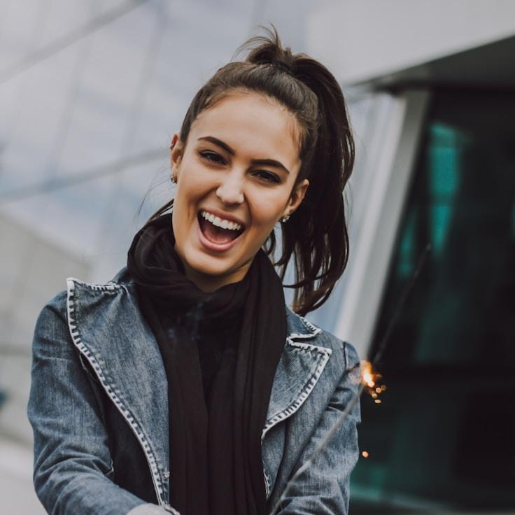 Avery Chen, Lead Design Curator at Neat Studio Hub, reviewing corporate floral arrangements